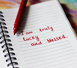 Message, notepad. Make notes, faith. I am lucky. Be happy. Love yourself. Help yourself. Mantra.
